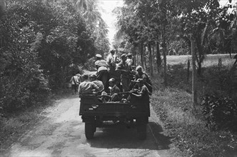 Column of army trucks with infantrymen; Date 1946; Location Indonesia, Dutch East Indies