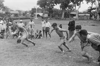 Historical Indonesia: Men running a race in Indonesia ca. 1947