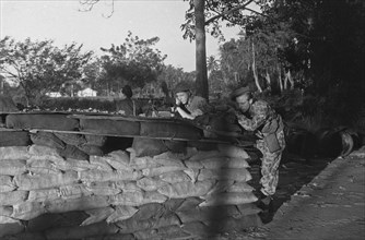 Dutch Soldiers in position behind a reinforcement with sandbags in Indonesia, Dutch East Indies ca. 1947