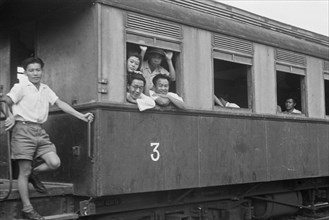 Rail car with passengers; Date 1947; Location Indonesia, Dutch East Indies