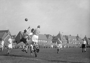 October 10, 1947 - Men's Soccer Match, ball in air prior to goal being scored. Possibly a game being played in Holland.