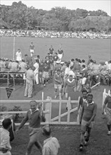 Players leave field after soccer game - August 31, 1948 Location Indonesia, Medan, Dutch East Indies, Sumatra
