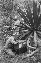 Indonesia History - 'Jungleradio'. Soldiers working on a field radio; Date December 1946; Location Indonesia, Dutch East Indies