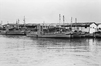 Docked tugboats; Date February 22, 1948; Location Indonesia, Indonesia, Java, Dutch East Indies, Tandjong Priok