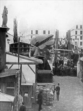 Statue of Liberty History - External area of the workshop in Paris, showing construction materials, the head of the Statue of Liberty, and a group of men ca. 1883