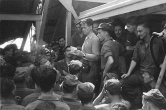 Mail is distributed on the ship; Mail call on a Dutch ship; Date October 19, 1946 Location Batavia, Indonesia, Jakarta, Dutch East Indies, Tandjong Priok