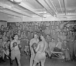 Boxing match in the hold of the Boissevain; Date October 24, 1946; Location Indonesia Dutch East Indies