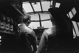 Pilots in the cockpit of an aircraft; Date September 1946; Location Indonesia, Dutch East Indies