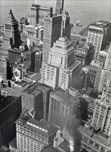 Hudson River and piers just visible at top of view of buildings in lower Manhattan ca. 1938