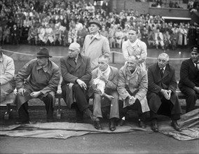 September 21, 1947 - Men on sidelines watching soccer match between Switzerland and Holland (possibly coaches)