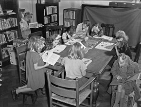 1940s Libraries - Young boys and girls in the children's reading room Wijdesteeg in Amsterdam ca. October 1947