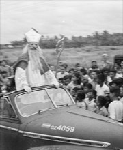 Saint Nicholas in open car during parade in Batavia (Jakarta), Indonesia, Jakarta, Dutch East Indies ca. 1947