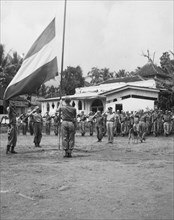 Soldiers saluting the Dutch flag in Cilimus, Cirebon, Indonesia, Dutch East Indies ca. 1947