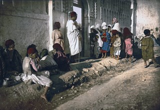 Beggars in front of mosque 'Sidi Abderrhaman', Algiers, Algeria ca. 1899