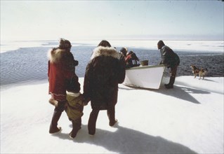 6/18/1973 Eskimo family traveling through open spring ice leads of Krusenstern Lagoon