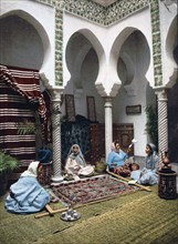 Moorish women making Arab carpets, Algiers, Algeria ca. 1899