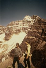 July 1975 - Hikers in front of Mount Igikpak from upper Reed River