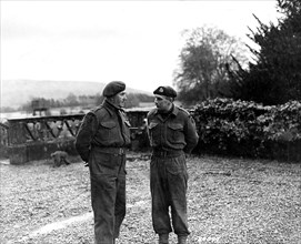 Lt. Col. Vaughan, Commander of a Commando Depot , confers with his second in command, Major Peter Cookcraft, on the day's schedule for a Ranger Unit. Scotland, February 12, 1943. Lt.. Col. C.E. Vaugha...