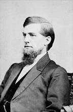 Photograph shows Maine congressman Eugene Hale, half-length portrait, seated 1874