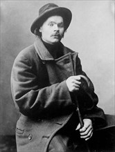 Maxim Gorky, seated with heavy coat on 2 7 1910