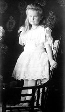 Grand Duchess Anastasie, standing in chair