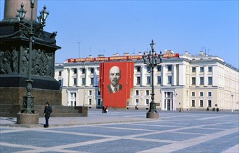 Alexander Column in Palace Square in St. Petersburg Russia in the late 1970s, banner of Vladimir Lenin adorns a building (ca. 1978)