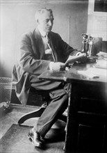 Warren G. Harding at desk 8 5 1910