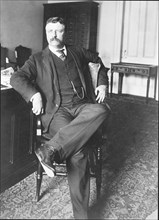 Theodore Roosevelt, full-length portrait, in office sitting in chair , facing front 9 8 1902