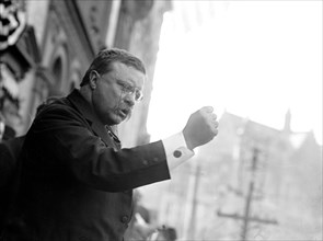 Theodore Roosevelt speaking, gesticulating with fist, outside, Yonkers, NY 1910