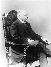 von Buelow, seated in chair 1908