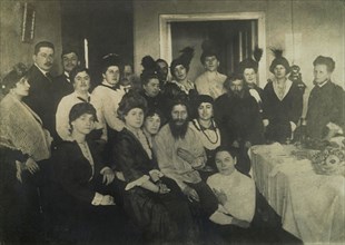 Rasputin surrounded by his admirers in St. Petersburg
