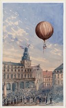 Balloon with two passengers ascending over a town square, with French flags flying from tower and many spectators below