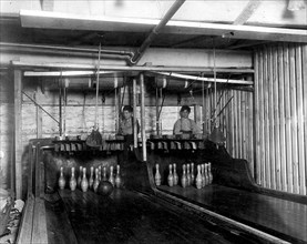 Bowling Alleys, connected with Geo P. Grays, Bastable Cafe. About 8 very small boys employed here. Work until midnight. Photo taken at 1130 P.M., February 1910