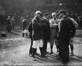 Managers and umpires talking about ground rules before a baeball game ca. October 8, 1915