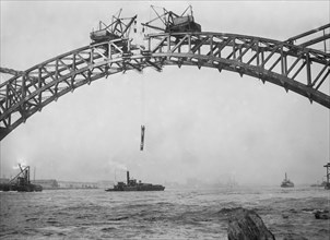 Workers completing Hell Gate Bridge, originally the New York Connecting Railroad Bridge, or the East River Arch Bridge ca. 1912-1916