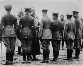 Kaiser Wilhelm II of Germany (1859-1941) giving iron cross medal to aviators during World War I ca. 1914-1915