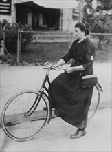 Woman telegraph messenger on a bicycle in Berlin, Germany during World War I ca. 1914-1915
