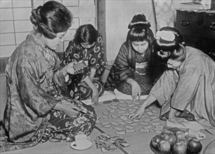 Group of Japanese women playing the card game Utagaruta ca. 1920s