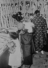 Japanese women browsing in a Hagoita Shop ca. 1910-1925