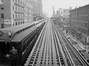 Express tracks of the Ninth Avenue El (elevated railroad) with a train, at the 14th Street Station in New York City ca. 1914-1915