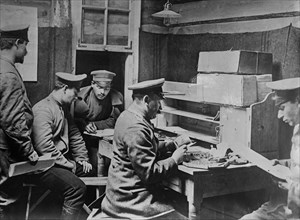 Soldiers checking the mail of prisoners at a prisoner of war camp at Döberitz (now Dallgow-Döberitz), Germany during World War I ca. 1915