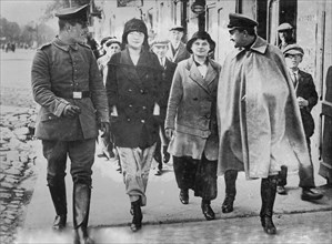 German soldiers walking with women in a Russian town during World War I ca. 1914-1915