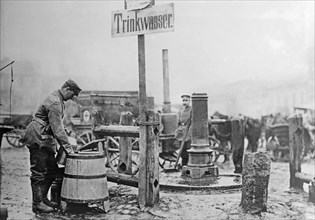 German 'Trinkwasser' (drinking water) next to a pump in Lodz, Poland during World War I ca. 1914-1915