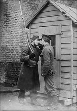 British and French soldier lighting a cigarette at Étaples, France during World War I ca. 1914-1915