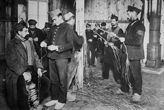 Prisoners making shoes from straw at Zossen prisoner of war camp, Wünsdorf, Zossen, Germany, during World War I ca. 1915