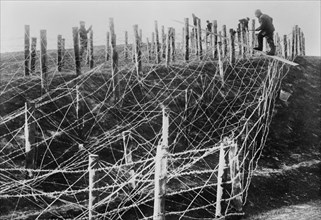German soldiers fixing a barbed wire entanglement during World War I ca. 1914-1915