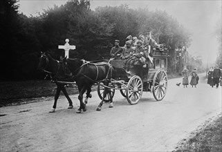 Horse-driven ambulance carrying wounded soldiers in the Forest of Laigne, France during World War I ca. 1914