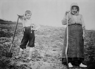 Mother and son working in the fields of Belgium ca. 1910-1915