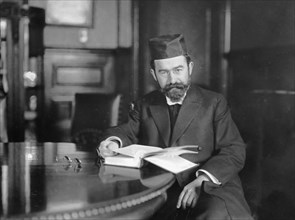 Rabbi Hertz sitting in office ca. 1910-1930