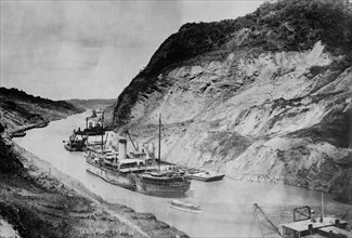 A ship passing through Culebra Cut -- Panama Canal ca. 1910-1915